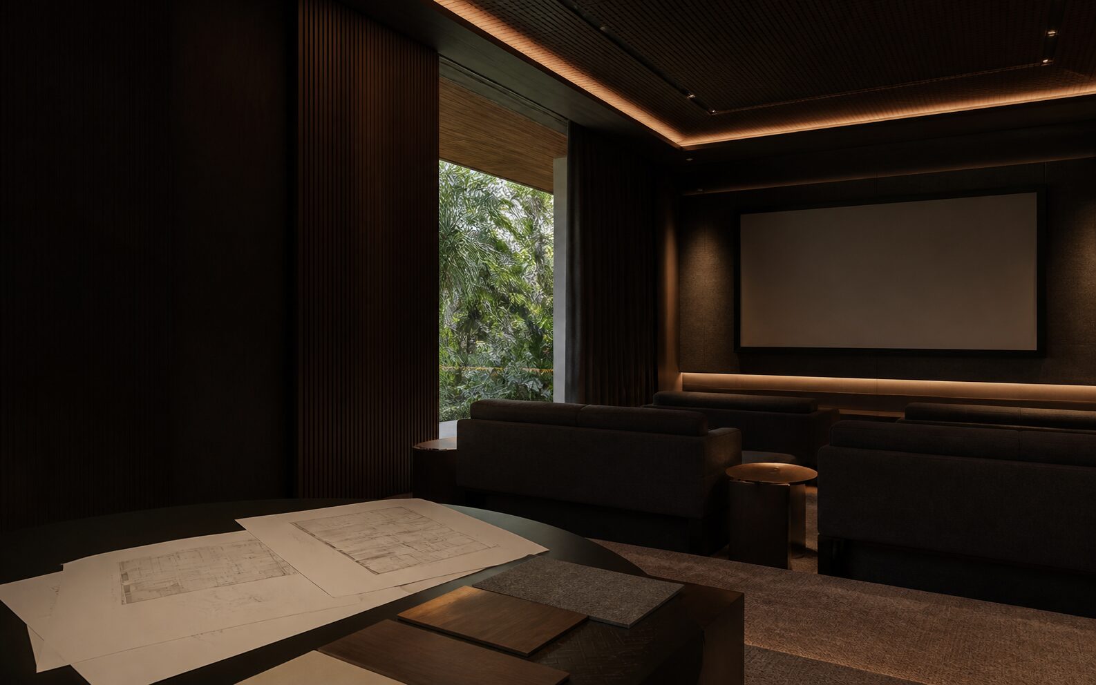 Conceptual Kochi home cinema planning room with a blank screen, seating, room drawings and tropical greenery outside.